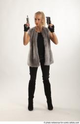 NIKOL STANDING POSE WITH TWO GUNS